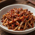 데친 오가피순을 간장 등 양념에 무쳐 만든 나물 요리