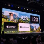 Apple WWDC 2026 keynote stage with large screen showing iOS 20 features