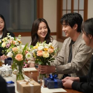 박위 송지은 부부가 집에서 감사의 마음을 담아 준비한 연말 파티 장면, 정성스러운 꽃다발과 선물, 그리고 초대된 사람들의 따뜻한 미소
